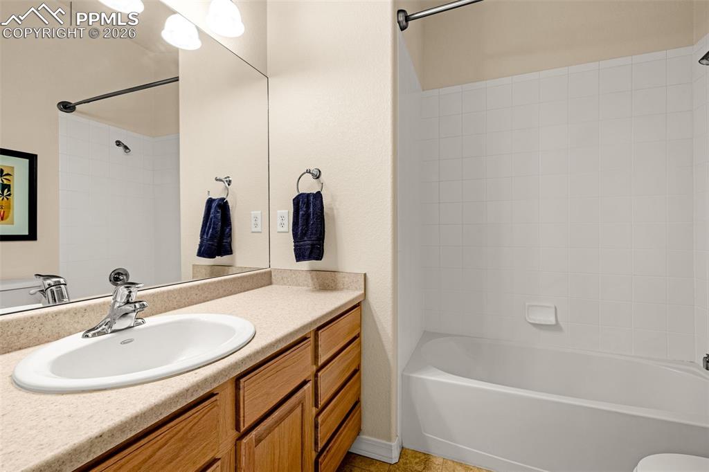 6658 Bethesda Point, Unit A Colorado Springs, CO 80918 - Photo 29 of 44 a bathroom with a sink and a mirror