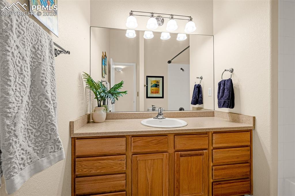 6658 Bethesda Point, Unit A Colorado Springs, CO 80918 - Photo 30 of 44 a bathroom with a sink and a mirror