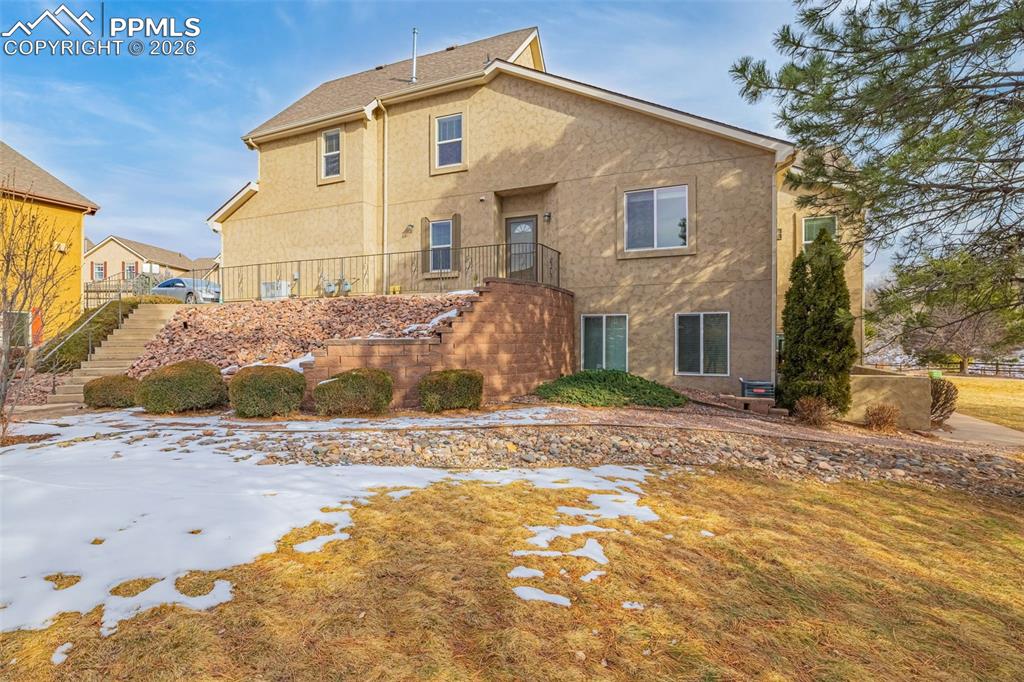 6658 Bethesda Point, Unit A Colorado Springs, CO 80918 - Photo 31 of 44 a view of a house with a yard