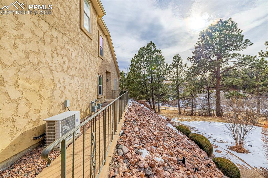 6658 Bethesda Point, Unit A Colorado Springs, CO 80918 - Photo 33 of 44 a view of a pathway with a wrought fence