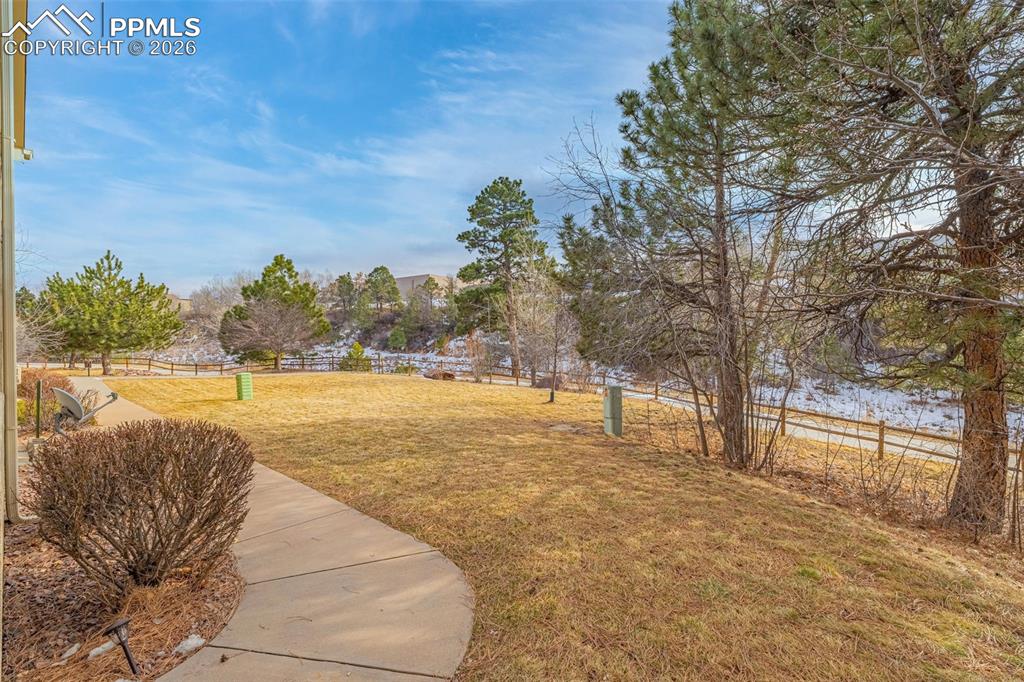 6658 Bethesda Point, Unit A Colorado Springs, CO 80918 - Photo 34 of 44 a view of yard with swimming pool and trees
