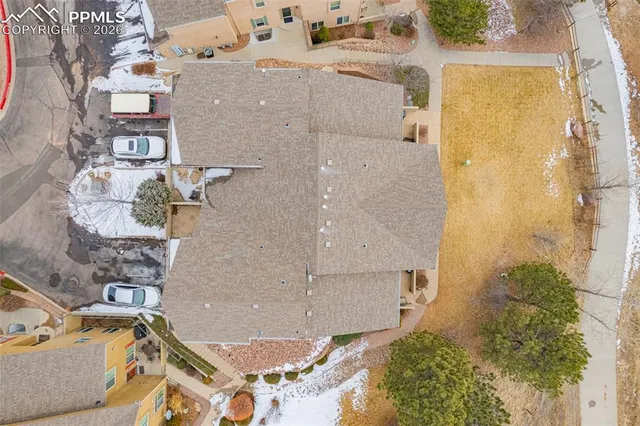 an aerial view of residential houses with outdoor space