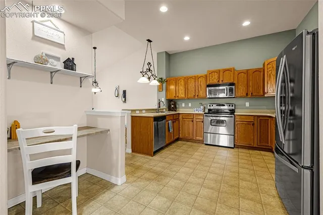 a kitchen with cabinets and appliances