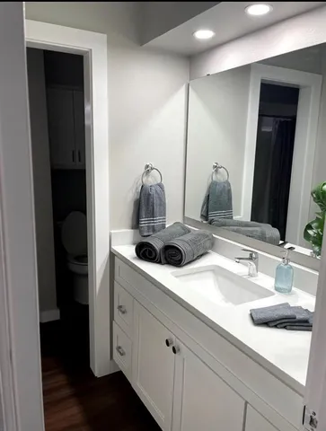 a bathroom with a sink and mirror