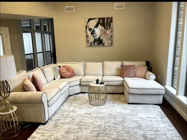 a living room with furniture and a rug