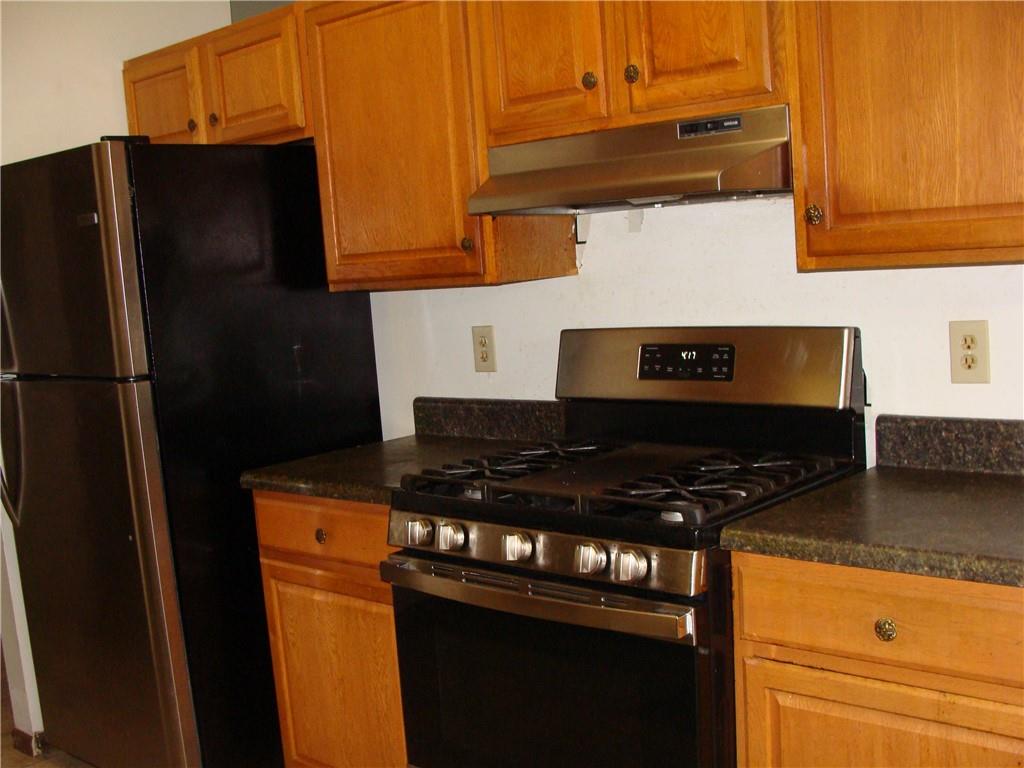2331 Newgate Drive Decatur, GA 30035 - Photo 19 of 33 a kitchen with stainless steel appliances granite countertop a refrigerator and a stove
