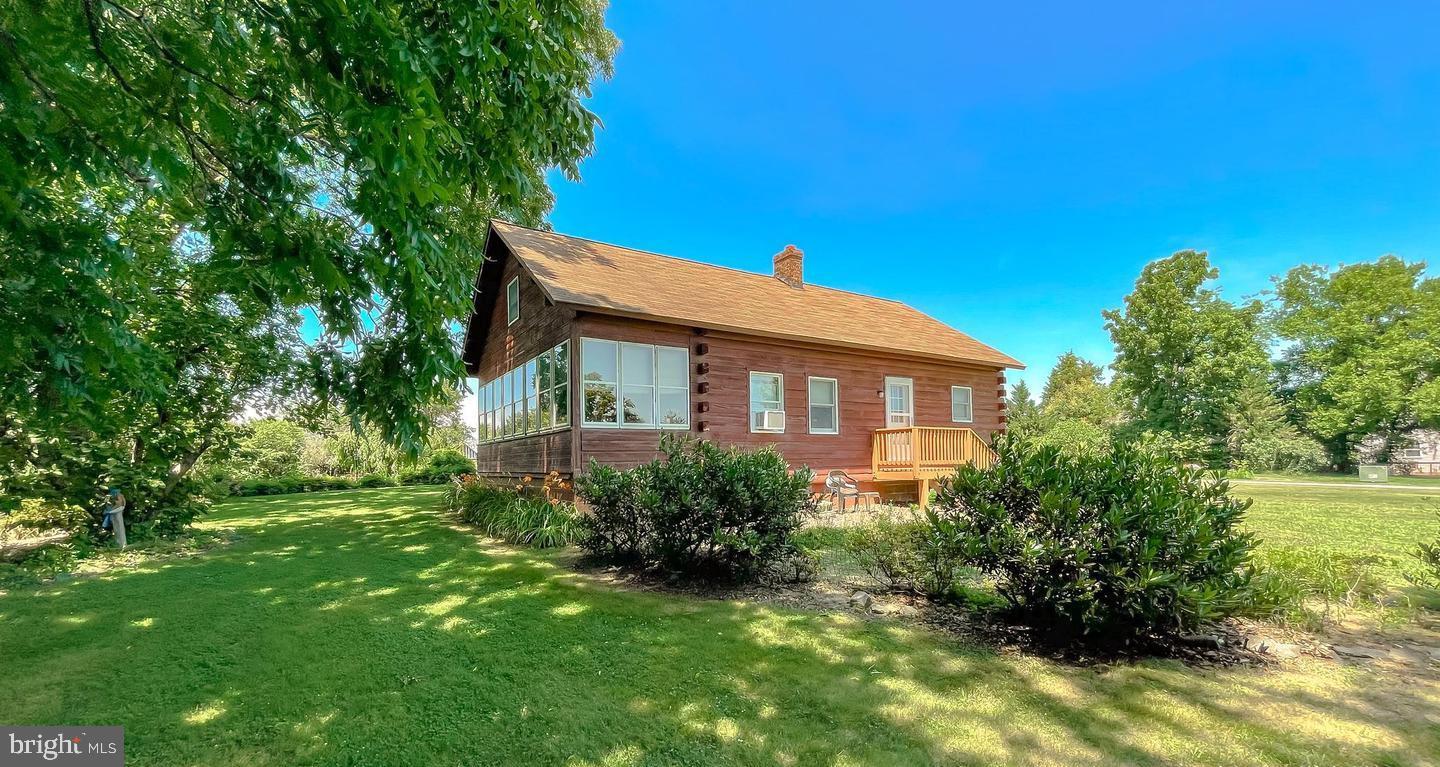23581 Belmar Drive Leonardtown, MD 20650 - Photo 1 of 54 a view of a house with a big yard plants and large trees