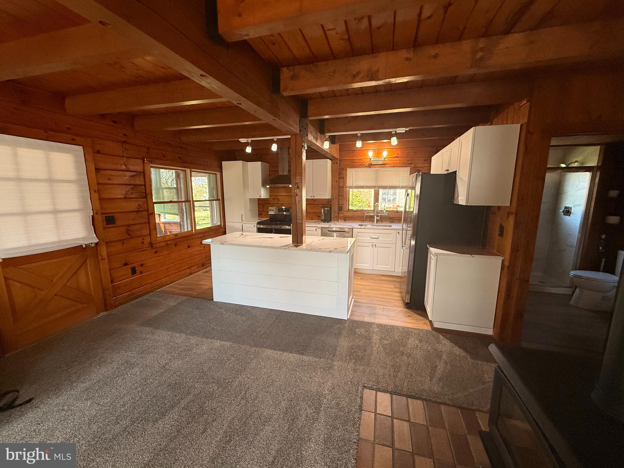 23581 Belmar Drive Leonardtown, MD 20650 - Photo 11 of 54 a view of a big room with wooden floor and windows