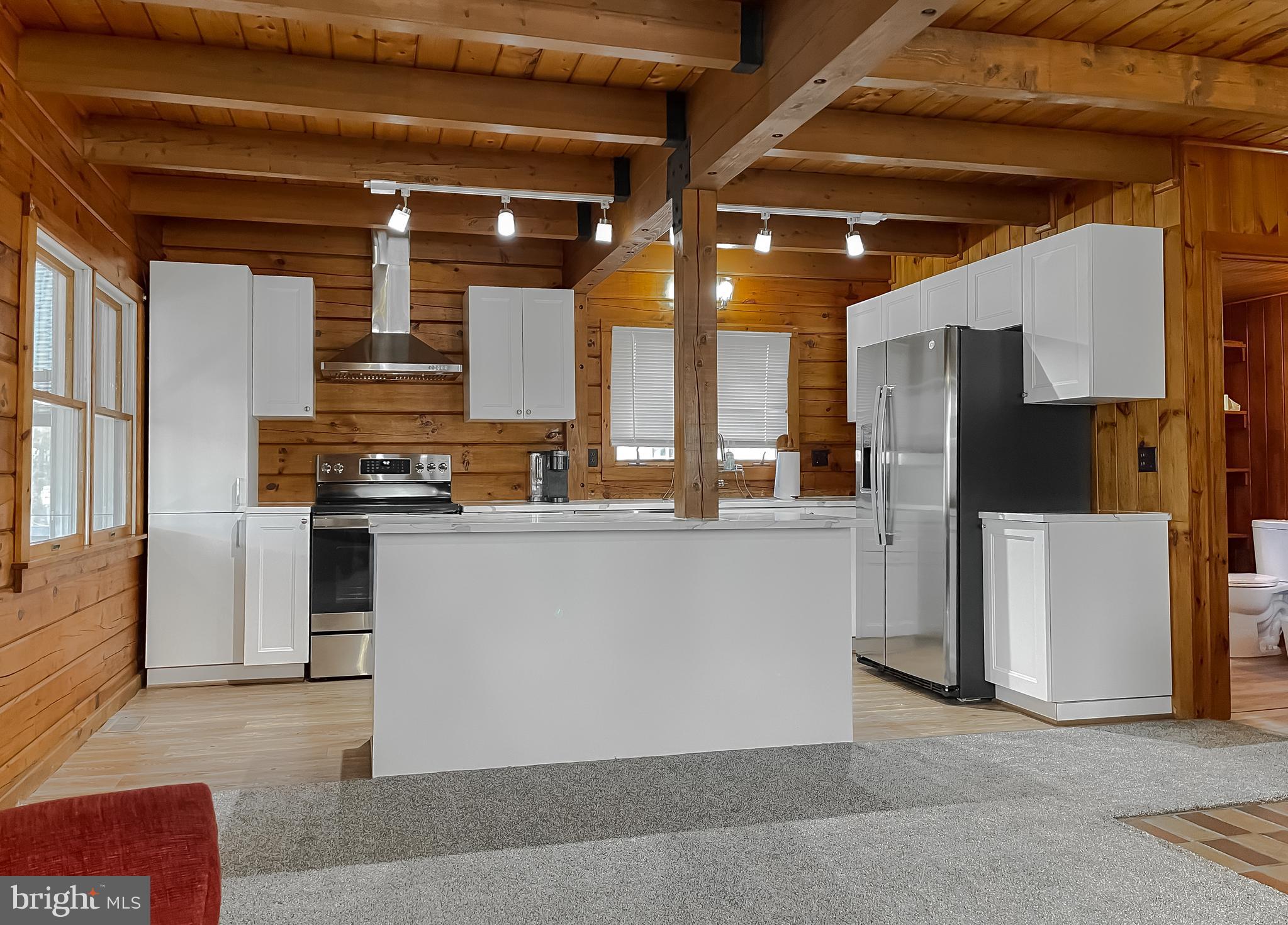 23581 Belmar Drive Leonardtown, MD 20650 - Photo 12 of 54 a large kitchen with stainless steel appliances kitchen island granite countertop a refrigerator and a stove