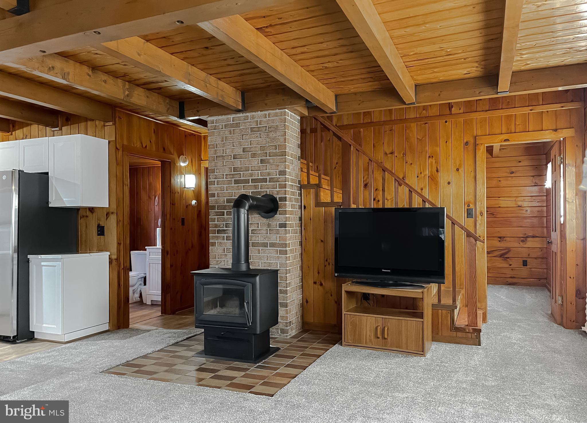 23581 Belmar Drive Leonardtown, MD 20650 - Photo 15 of 54 a living room with furniture and a flat screen tv