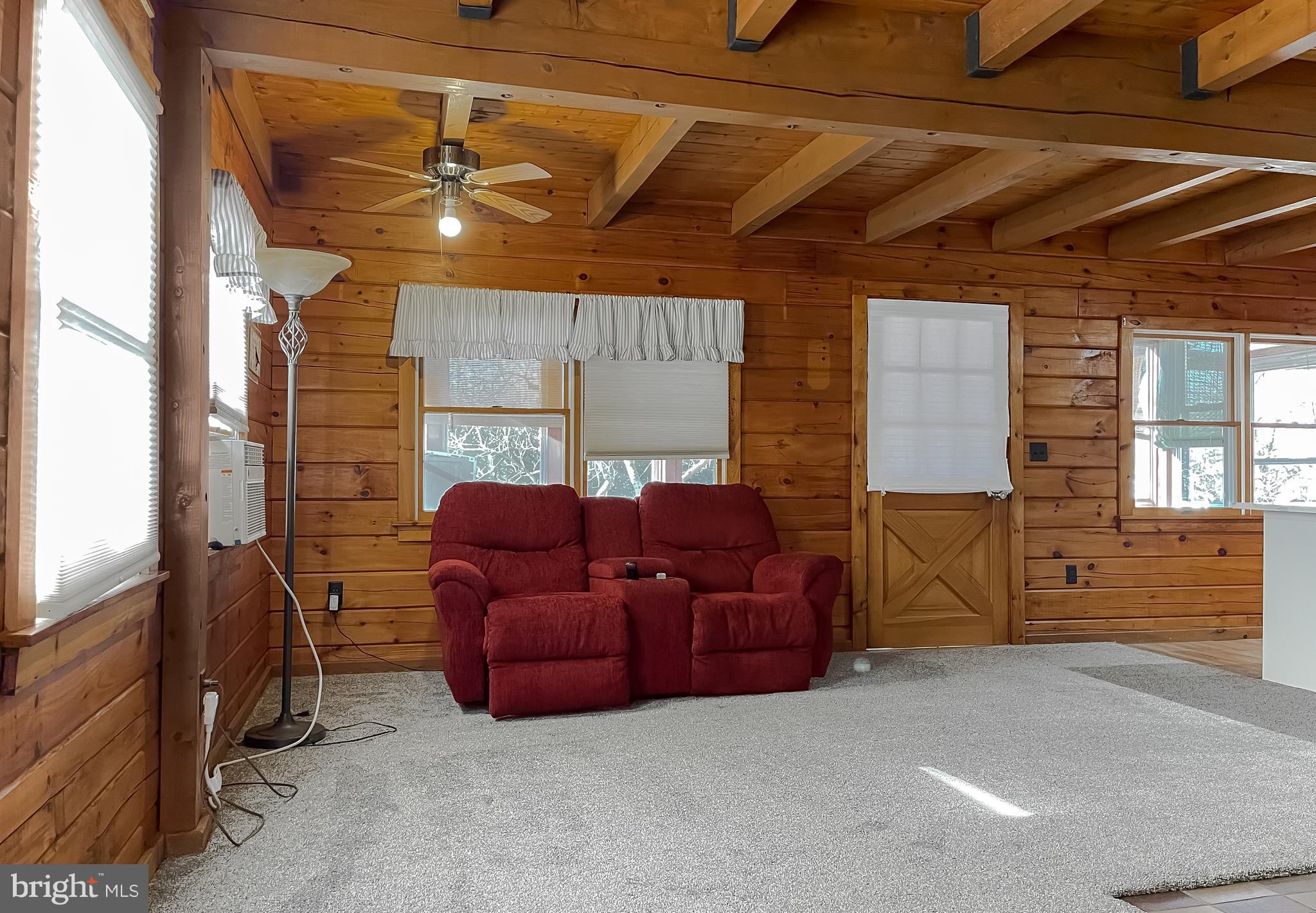 23581 Belmar Drive Leonardtown, MD 20650 - Photo 18 of 54 a media room with lots of chairs and chandelier