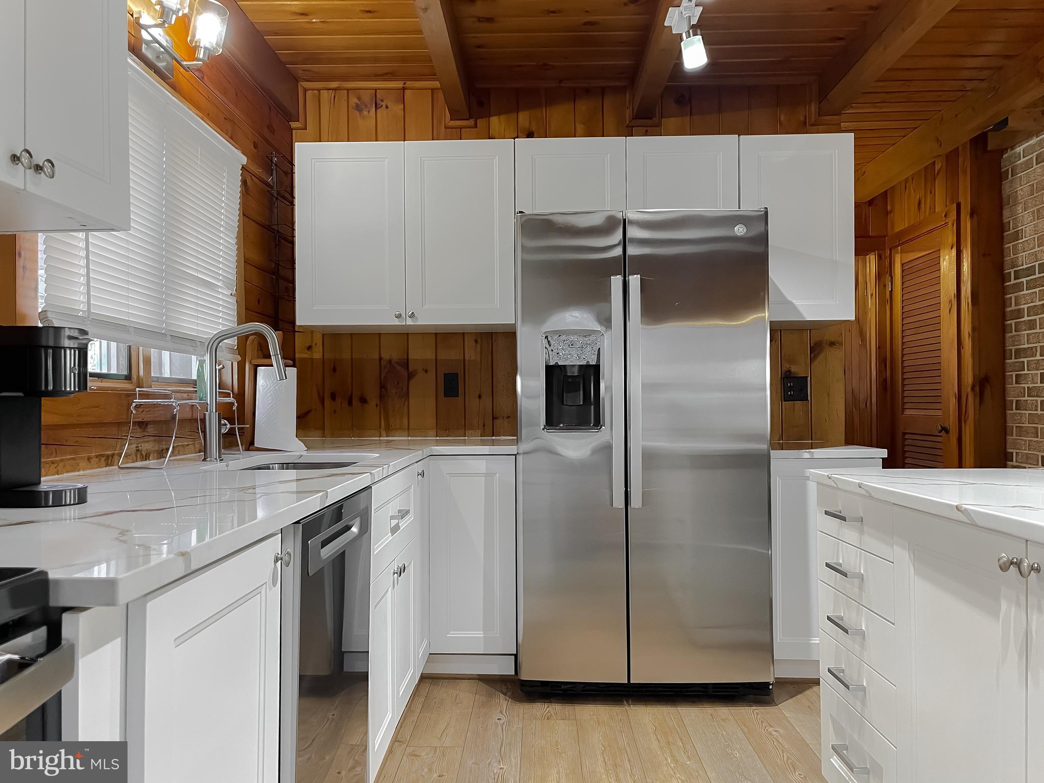 23581 Belmar Drive Leonardtown, MD 20650 - Photo 2 of 54 a kitchen with stainless steel appliances a sink and a refrigerator