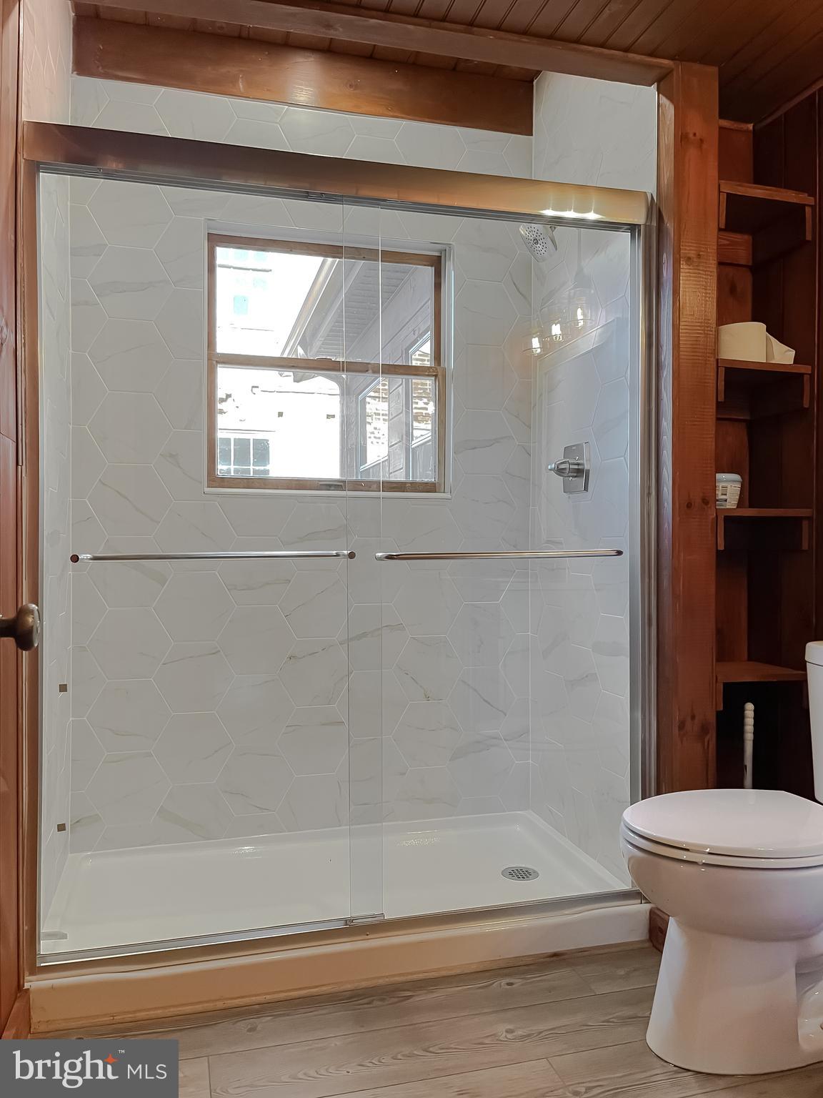 23581 Belmar Drive Leonardtown, MD 20650 - Photo 23 of 54 a bathroom with a toilet and a shower