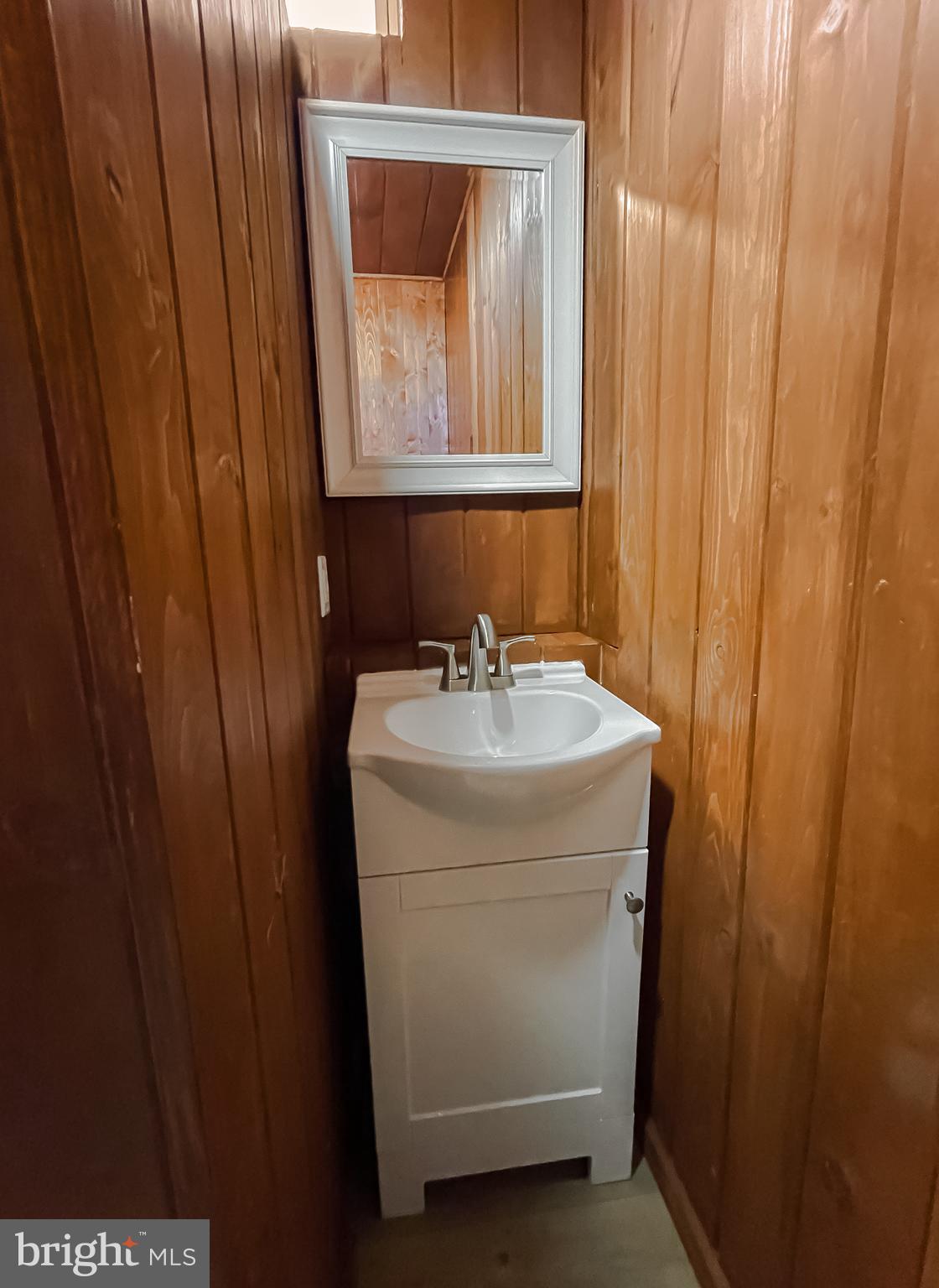 23581 Belmar Drive Leonardtown, MD 20650 - Photo 30 of 54 a bathroom with a sink and a mirror