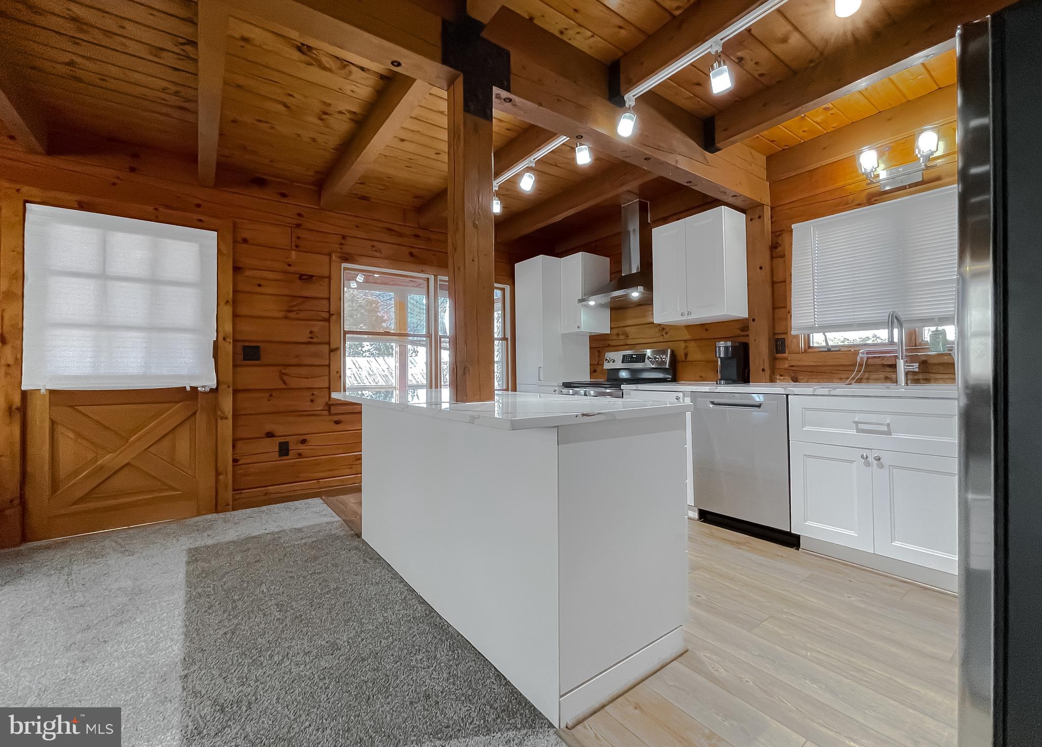 23581 Belmar Drive Leonardtown, MD 20650 - Photo 7 of 54 a kitchen with cabinets a sink and appliances