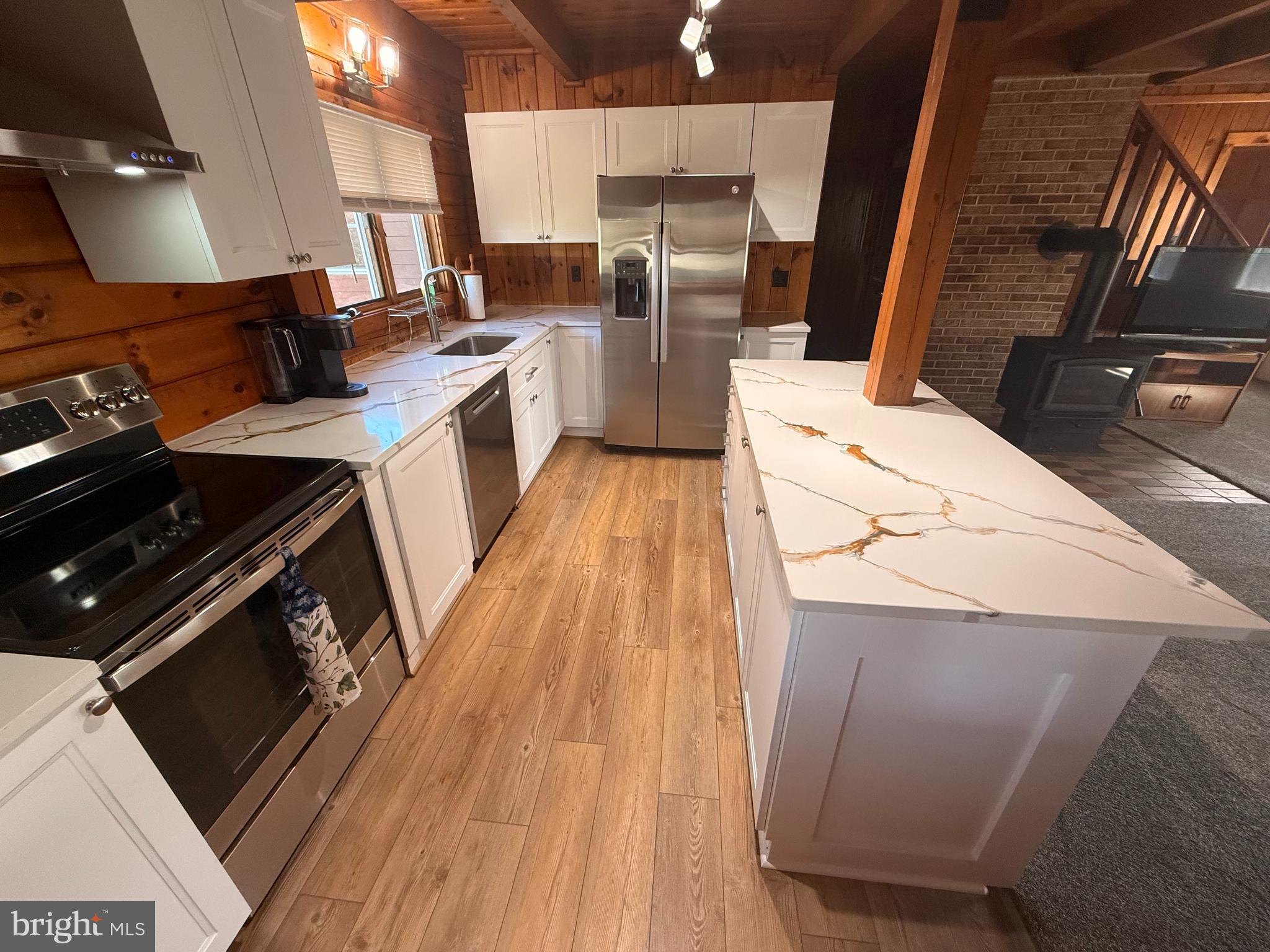 23581 Belmar Drive Leonardtown, MD 20650 - Photo 8 of 54 a kitchen with a sink wooden floor and stainless steel appliances