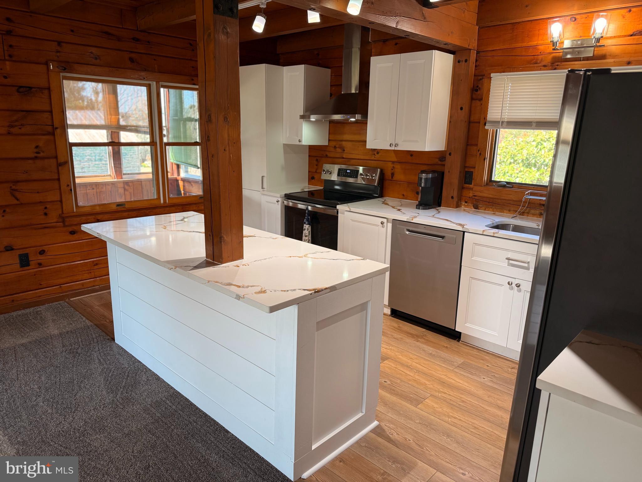 23581 Belmar Drive Leonardtown, MD 20650 - Photo 10 of 54 a kitchen with stainless steel appliances granite countertop a sink stove and refrigerator