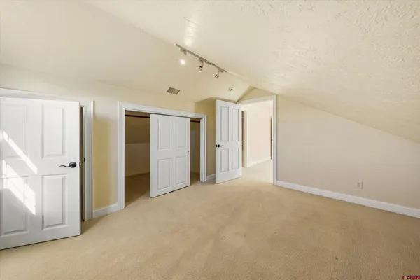 a view of a hallway with a window