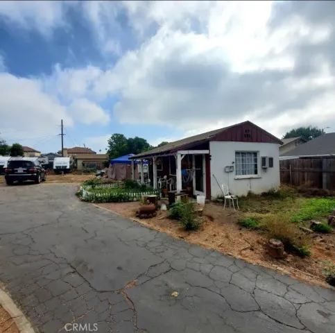 a view of house with outdoor space and porch