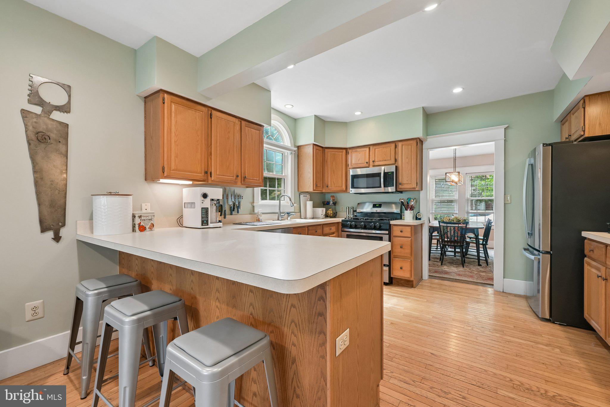 121 Villanova Road Glassboro, NJ 08028 - Photo 12 of 31 a kitchen with a sink a counter top space stainless steel appliances and cabinets