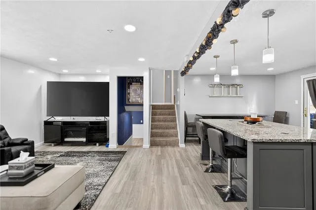 a view of a livingroom with furniture and a fireplace