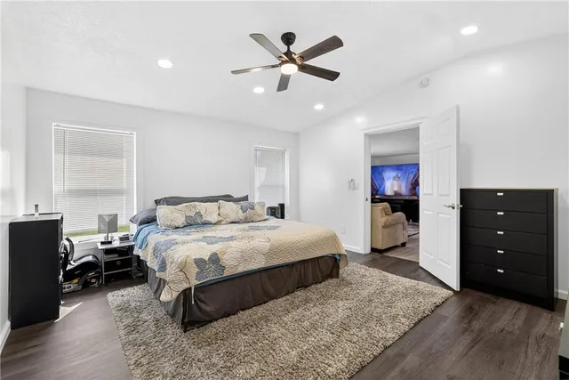 a bedroom with a bed and a dresser