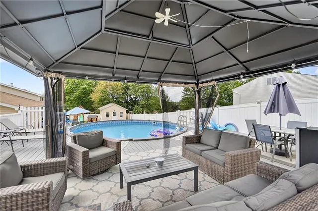 a outdoor living space with patio furniture and a potted plant