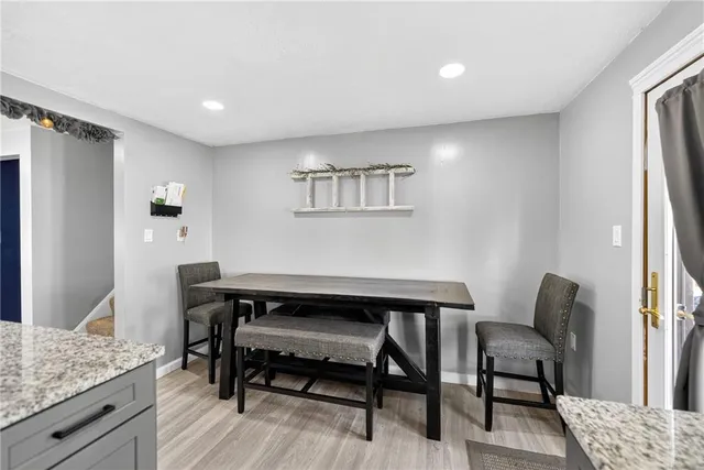 a view of a workspace with furniture and a couch