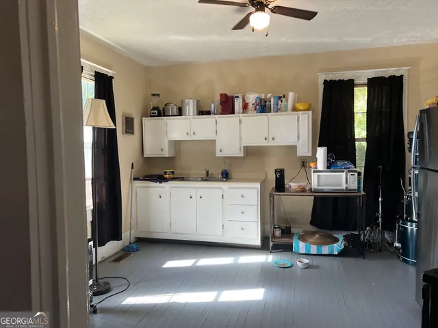 a room with furniture and a ceiling fan