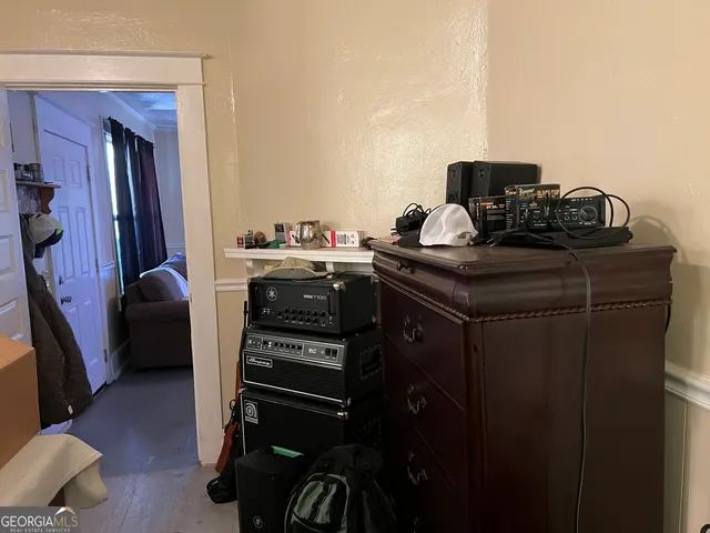 a room with furniture and musical instruments