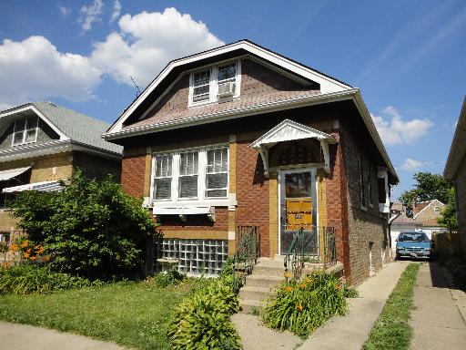2529 Grove Avenue Berwyn, IL 60402 - Photo 1 of 16 a front view of a house with garden