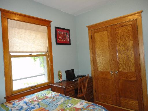 2529 Grove Avenue Berwyn, IL 60402 - Photo 12 of 16 a bedroom with a bed and a window