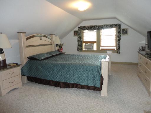 2529 Grove Avenue Berwyn, IL 60402 - Photo 6 of 16 a bedroom with a bed and window