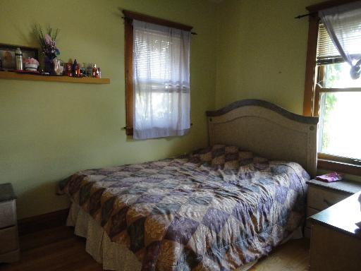 2529 Grove Avenue Berwyn, IL 60402 - Photo 10 of 16 a bedroom with a bed and a window
