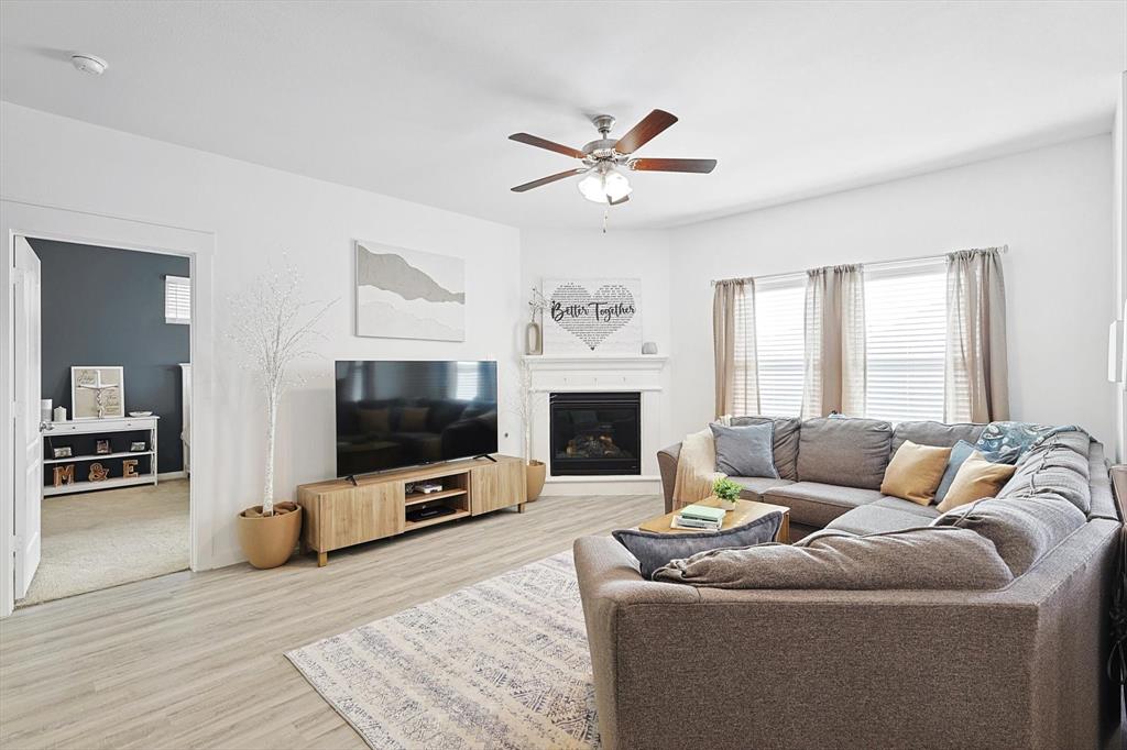4235 Bullock Lane Forney, TX 75126 - Photo 15 of 40 a living room with furniture and a flat screen tv