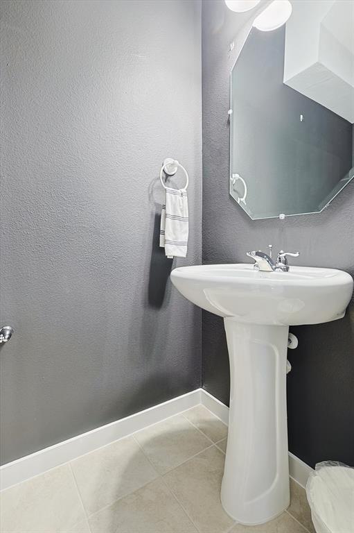 4235 Bullock Lane Forney, TX 75126 - Photo 20 of 40 a bathroom with a sink and mirror