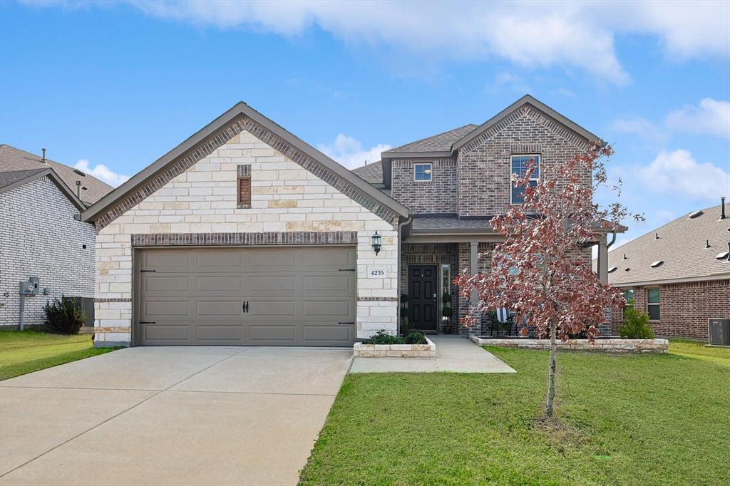 4235 Bullock Lane Forney, TX 75126 - Photo 2 of 40 a view of a house with a yard and garage