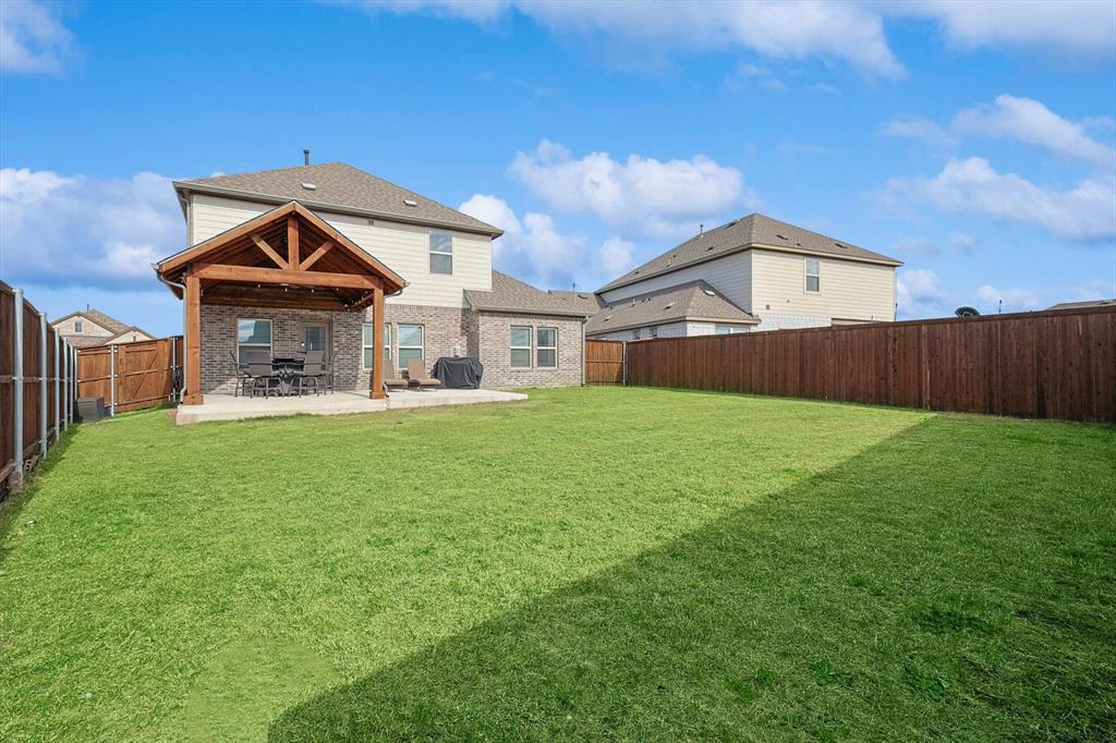 4235 Bullock Lane Forney, TX 75126 - Photo 33 of 40 a front view of a house with garden