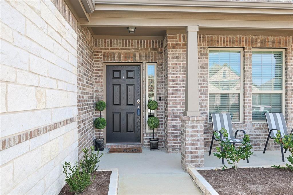 4235 Bullock Lane Forney, TX 75126 - Photo 5 of 40 a front view of a house with a garden