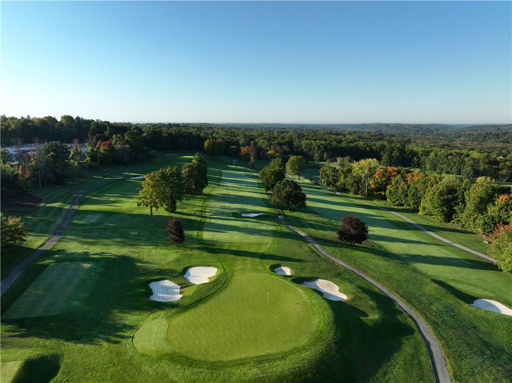 570 Bedford Road, Unit 52B Armonk, NY 10504 - Photo 31 of 36 a view of a golf course with a swimming pool