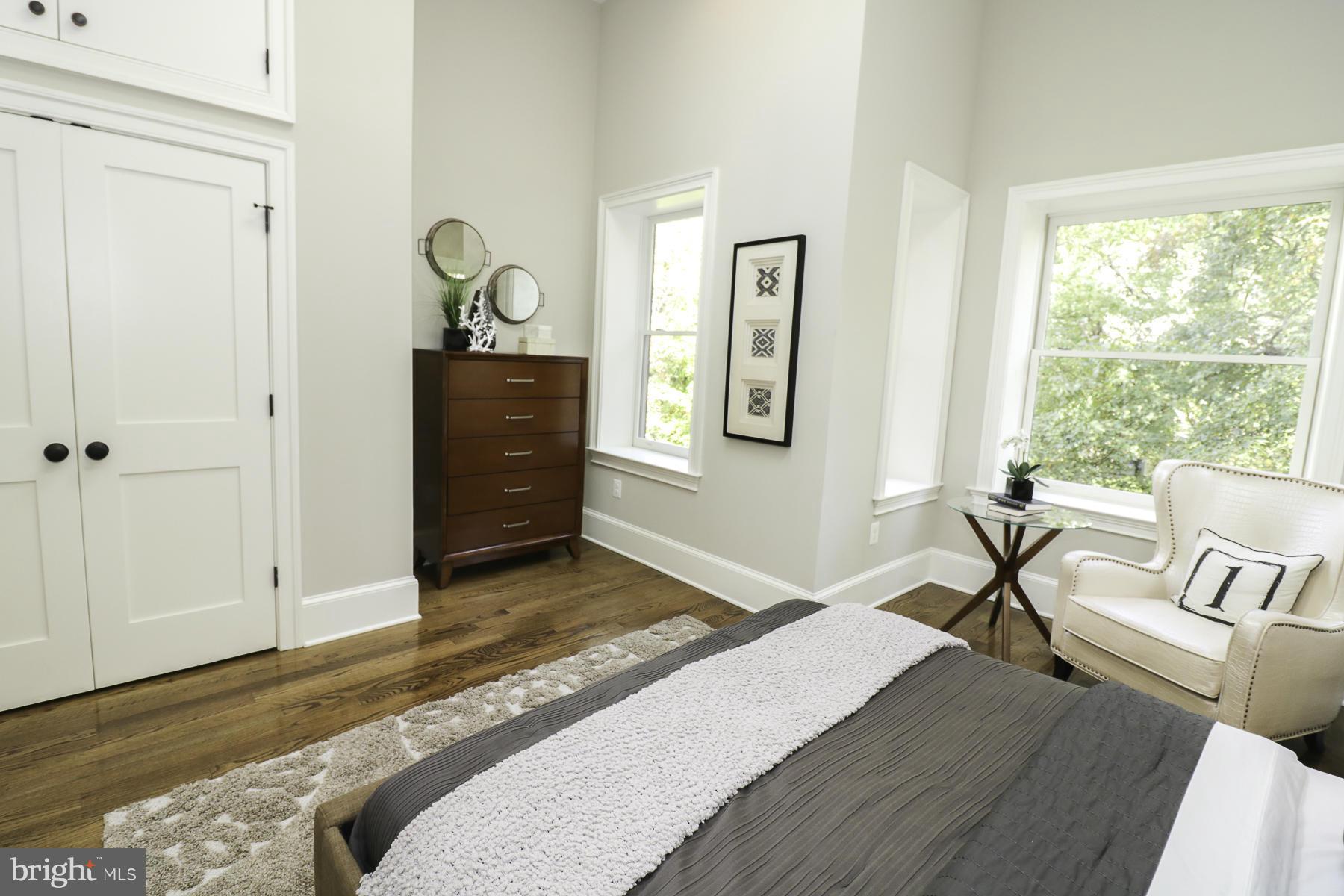 124 11th Street Northeast Washington, DC 20002 - Photo 16 of 30 a bedroom with a bed and wooden floor