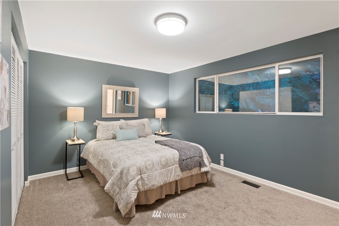 19728 45th Avenue Southeast Bothell, WA 98012 - Photo 15 of 25 a bedroom with a bed and window
