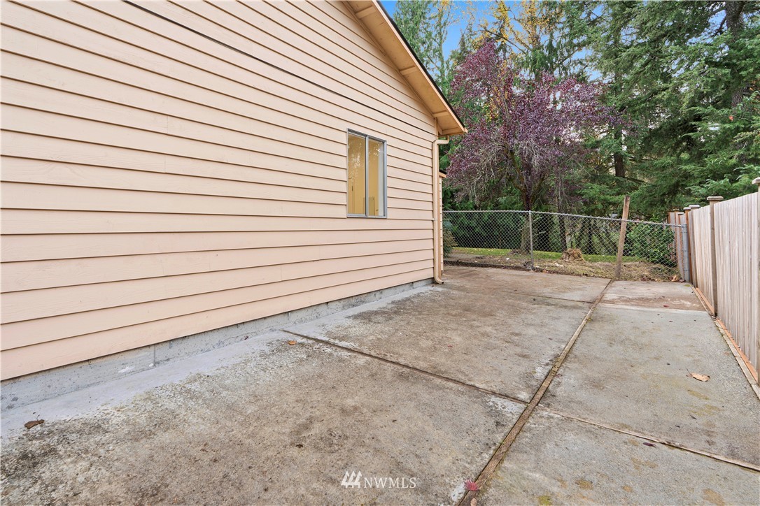 19728 45th Avenue Southeast Bothell, WA 98012 - Photo 4 of 25 a view of a backyard with a large tree