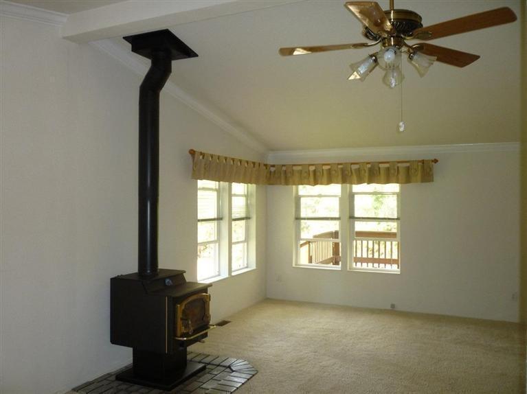 2695 Old Ferry Road Shady Cove, OR 97539 - Photo 15 of 31 Living room w/four windows looking out o