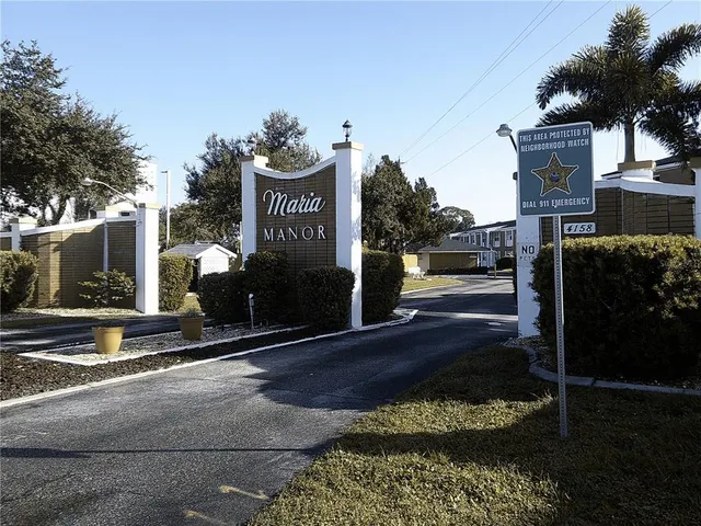 a sign on the side of a street