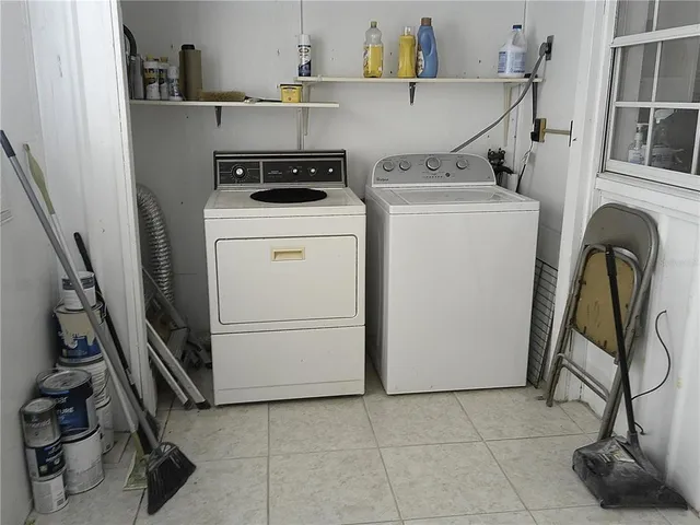 a utility room with dryer and washer