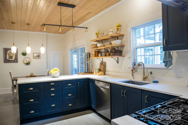 a kitchen with a sink and cabinets