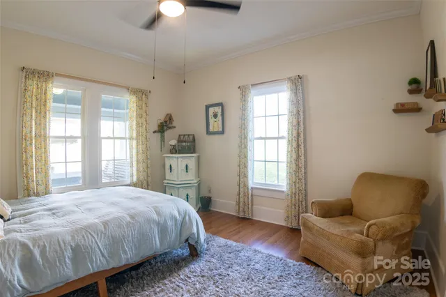 a spacious bedroom with a bed and a couch