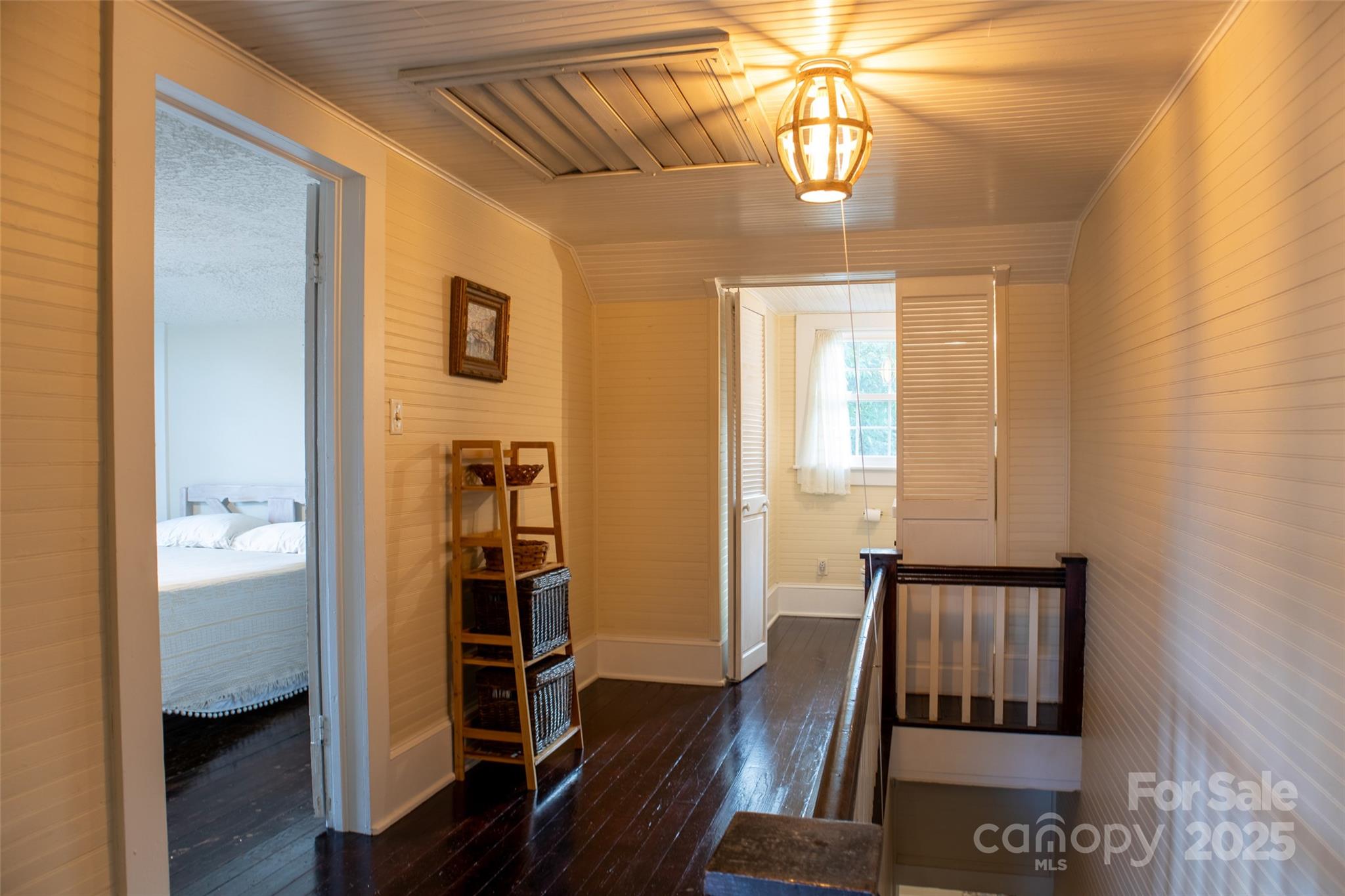 102 Cuthberson Street Morganton, NC 28655 - Photo 24 of 45 a view of a hallway with wooden floor and windows