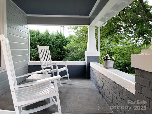a view of balcony with furniture